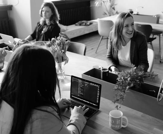 Three women working on their laptops